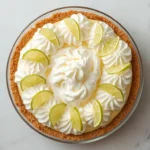 Keto key lime pie topped with whipped cream and key lime slices