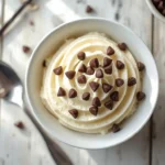Bowl of creamy keto cannoli cream topped with sugar-free chocolate chips
